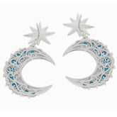 Stylish silver earrings with star and crescent moon design featuring blue accents.